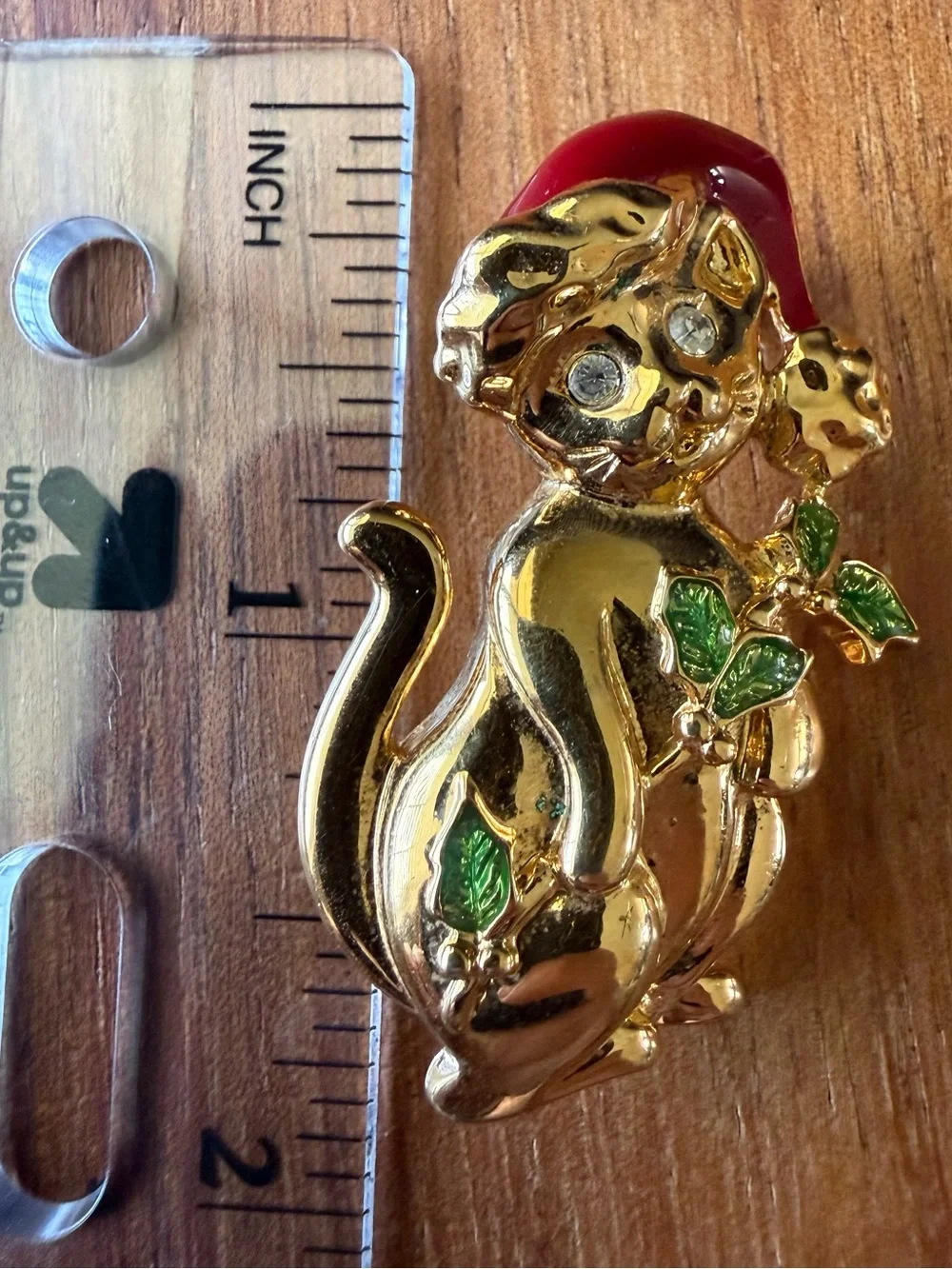 Vintage Gold Tone Christmas Cat Brooch with Red Hat and Green Leaf Accents Pin